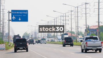 Looking Down A Highway By A Shell Garage On Sirisothorn Road Near Bangkok, Thailand