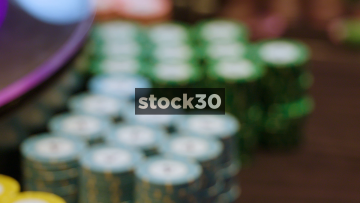Two Close Up Shots Of Casino Chips