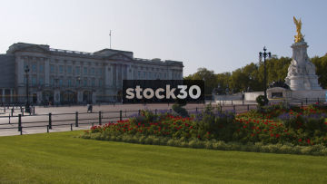 Wide Shot Of Buckimgham Palace And Victoria Memorial Statue In London, UK