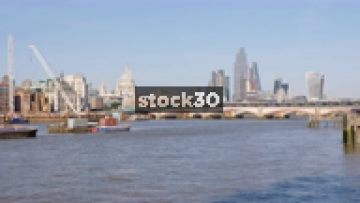 Wide Shot Of The River Thames In London With Blackfriar's Bridge And St Paul's Cathedral, UK