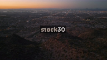 Early Evening Drone Shot Flying Over Camelback Mountain Towards Phoenix, Arizona, USA